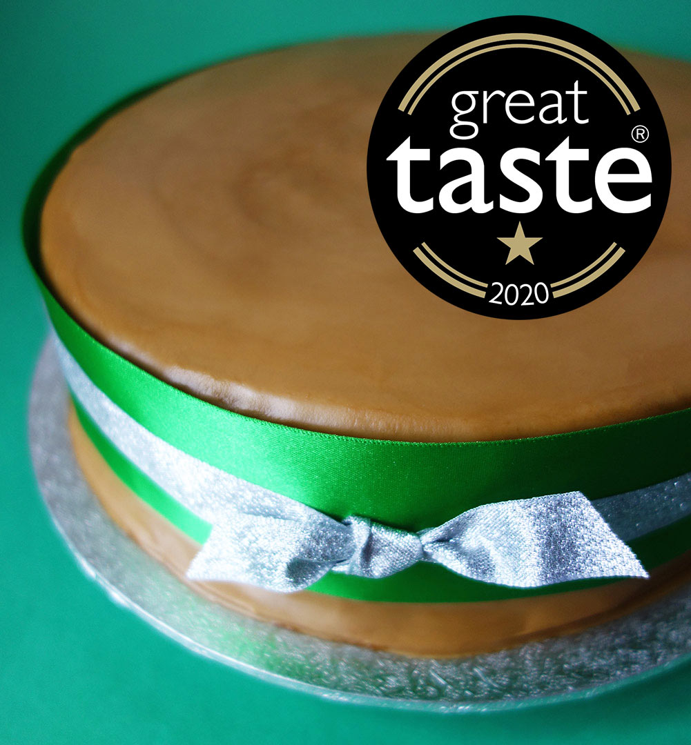 A Great Taste Award winner. Rich, rummy Luxury Fruit Cake, made with organic fruit steamed in Kingston 62 Jamaica rum and Spanish sherry. Sweetened with organic blackstrap molasses, no added sugar. Covered with organic Lübecker marzipan and dark rum frosting. All ingredients gluten free. Can be posted to addresses in the UK and abroad. Delivery by hand in London