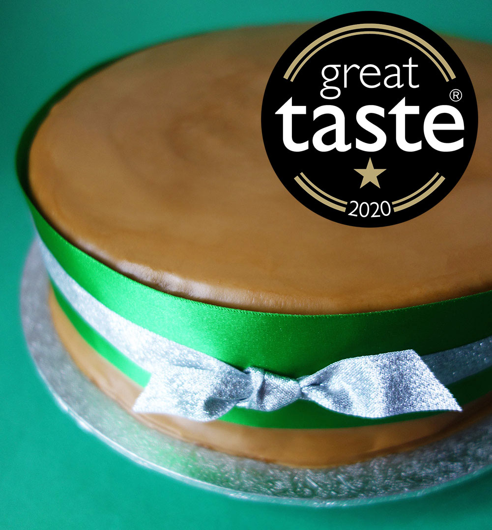 A Great Taste Award winner. Rich, rummy Luxury Christmas Cake, made with organic fruit steamed in Appleton Kingston 62 Jamaica Rum and Amontillado sherry. Sweetened with organic blackstrap molasses, no added sugar. Covered with organic Lübecker marzipan and dark rum frosting. All ingredients gluten free. Can be posted to addresses in the UK and abroad. Delivery by hand in London