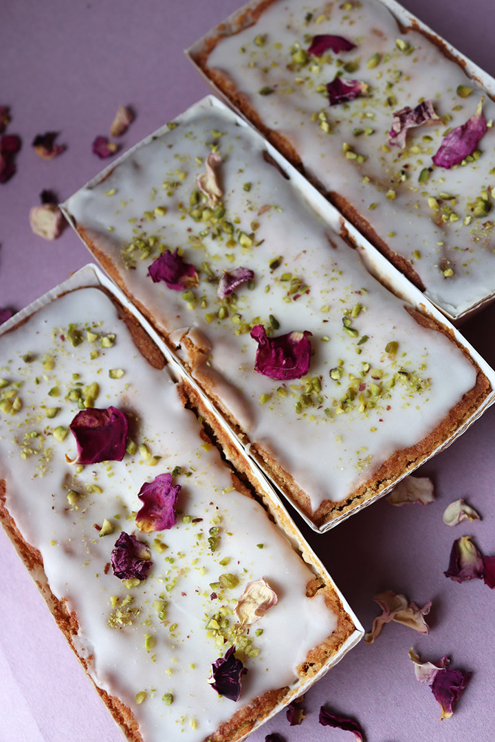 Lemon and Pistachio Loaf Cakes, made with gluten-free, wheat-free ingredients. Decorated with nibbed pistachios and rose petals. All ingredients glutenfree, wheatfree