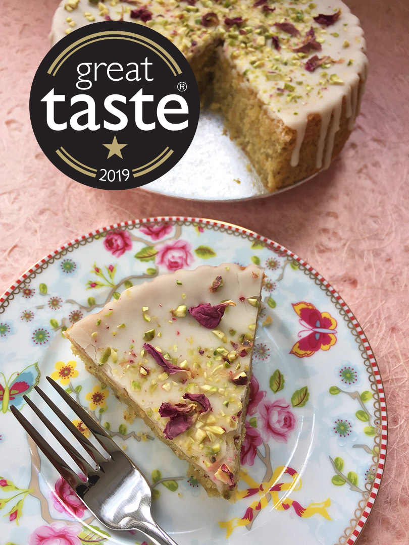 Awarded a Great Taste star this year – a moist, aromatic Lemon and Pistachio Cake. Made with gluten free, wheat free ingredients. Decorated here with fragrant organic rose petals. Delivery or collection in London, can be posted. All ingredients gluten-free