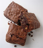 Gluten free spiced Brownies, made with organic, gluten-free ingredients: Fairtrade dark chocolate, butter, walnuts and flavoured with fresh orange zest and ground cardamom seeds