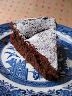 Chocolate & Prune Truffle Cake, made with gluten-free, dairy-free ingredients. Dusted with organic unrefined cane icing sugar