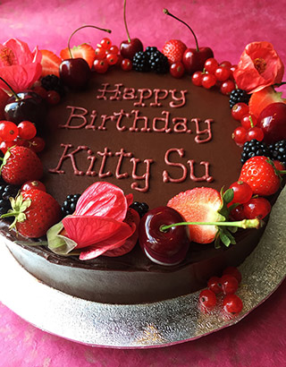 A single layer of gluten free, dairy free Chocolate and Olive Oil Cake, frosted with chocolate fudge buttercream and decorated with flowers and berries. All ingredients gluten-free