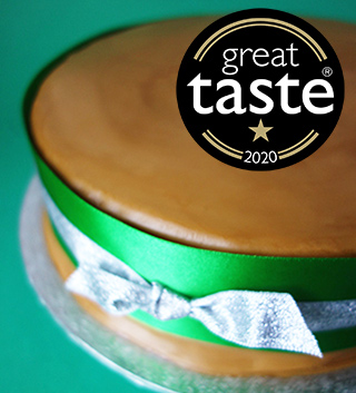 Award-winning gluten-free Christmas Cake, covered with organic Lübecker marzipan and dark rum frosting