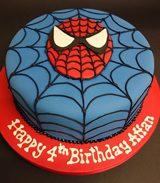 Gluten-free, dairy-free, egg-free Spiderman Chocolate Cake. Filled with dairy-free white chocolate buttercream and covered with sugarpaste icing