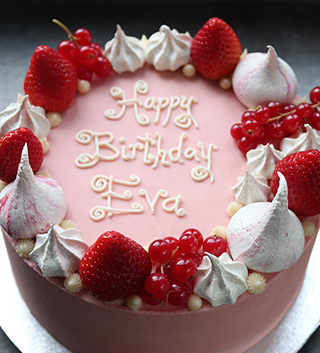 Gluten free celebration cakes – all shapes and flavours. This one, for a birthday, is a Madagascar vanilla cake, filled with vanilla buttercream and decorated with strawberries, redcurrants and meringue kisses. All ingredients gluten-free. Delivery in London & southeast
