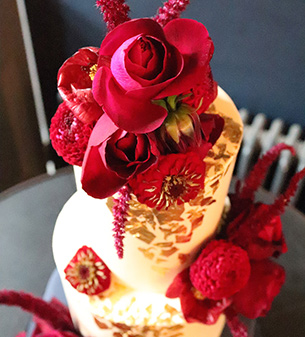 Exquisite gluten-free Wedding Cakes. This one is decorated with gold leaf and organic edible flowers. All ingredients glutenfree, wheatfree. Dairy free and vegan wedding cakes also available