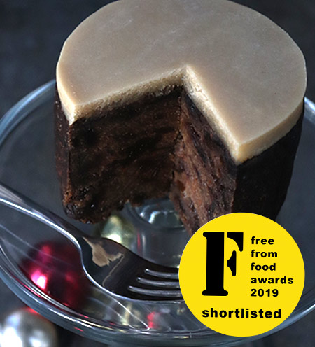 Now with organic Lübecker marzipan topping. A moist, dark, vegan fruitcake made with gluten free, dairy free organic ingredients: vine fruit & citrus zests, Bramley apples and ground almonds, as well as Appleton Jamaica Rum. Lightly sweetened with organic dates, no added sugar. Alcohol-free available. All ingredients gluten-free, dairy-free & free from animal products