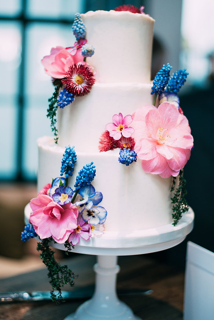 Gluten-free, vegan wedding cake, made with organic ingredients. Two flavours: Carrot & Coconut, and Orange & Almond. All made with gluten free ingredients, no animal products. Decorated with organic edible flowers.