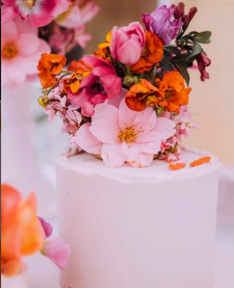 3 separate tall cakes for a Spring wedding at the Horniman Conservatory: White Chocolate & Raspberry, Chocolate & Olive Oil and Lemon & Vanilla. All ingredients gluten free. Price includes delivery and assembly at your London venue. Unsprayed flowers from Blooming Green